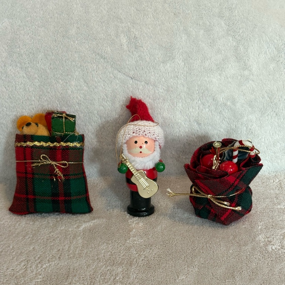 Three  hanging Christmas Ornaments a Santa and two red green plaid Gift Sacks 3”